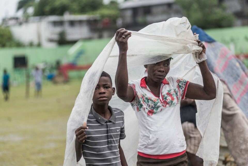 1,2 millioner mennesker er berørt av jordskjelvet i Haiti, ifølge Unicef. Bildet er fra utenfor byen Les Cayes, som ble hardt rammet. Hjelpearbeidet ble forsinket av den tropiske stormen «Grace» som kom inn over Haiti i etterkant av skjelvet. Foto: Reginald Louissant Jr. / AFP / NTB