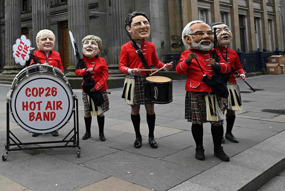 Oxfam stiller politiske krav til verdens ledere. Under klimatoppmøtet i Glasgow tok aktivister på seg masker som fremstilte verdens toppledere som står for store klimautslipp. Indias sterke mann, Narendra Modi (nr.2 fra høyre) er blant disse. Foto: NTB.