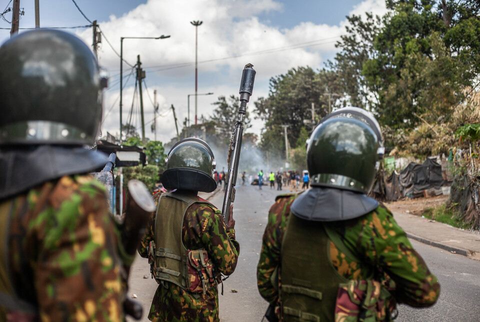 protesters shouts at police as they demonstrate in Kibera over the high cost of living on March 20, 2023