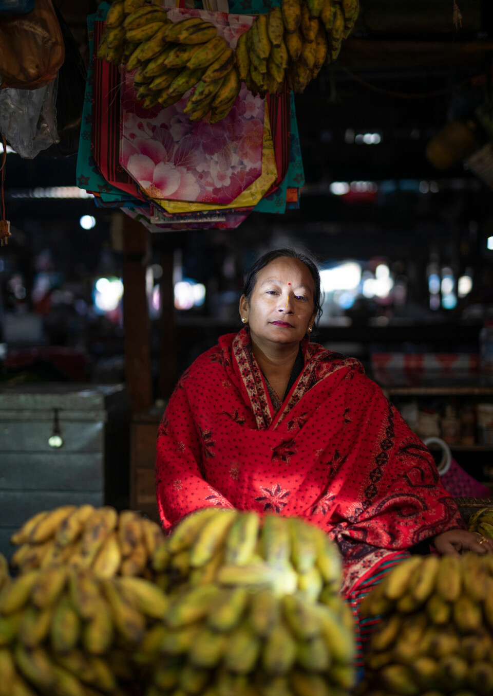 Victoria Oibam (50) selger bananer.